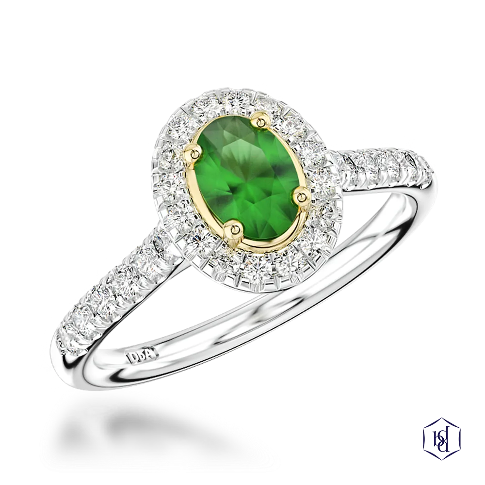 oval cut green tourmaline in a platinum shank and18ct yellow gold head cluster diamond band