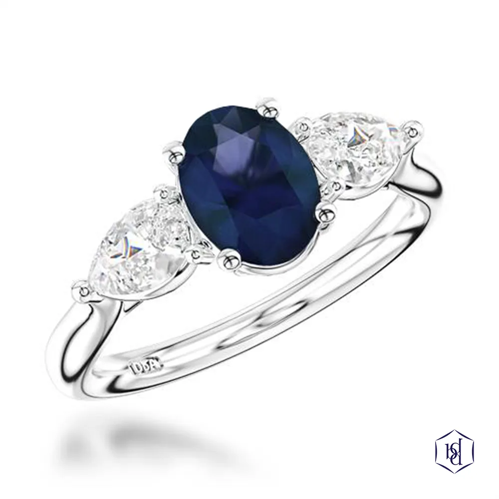 oval cut sapphire in a platinum three stone plain band