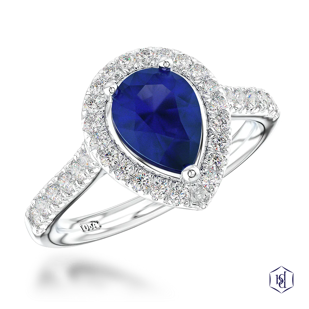 pear shape cut sapphire in a platinum cluster diamond band