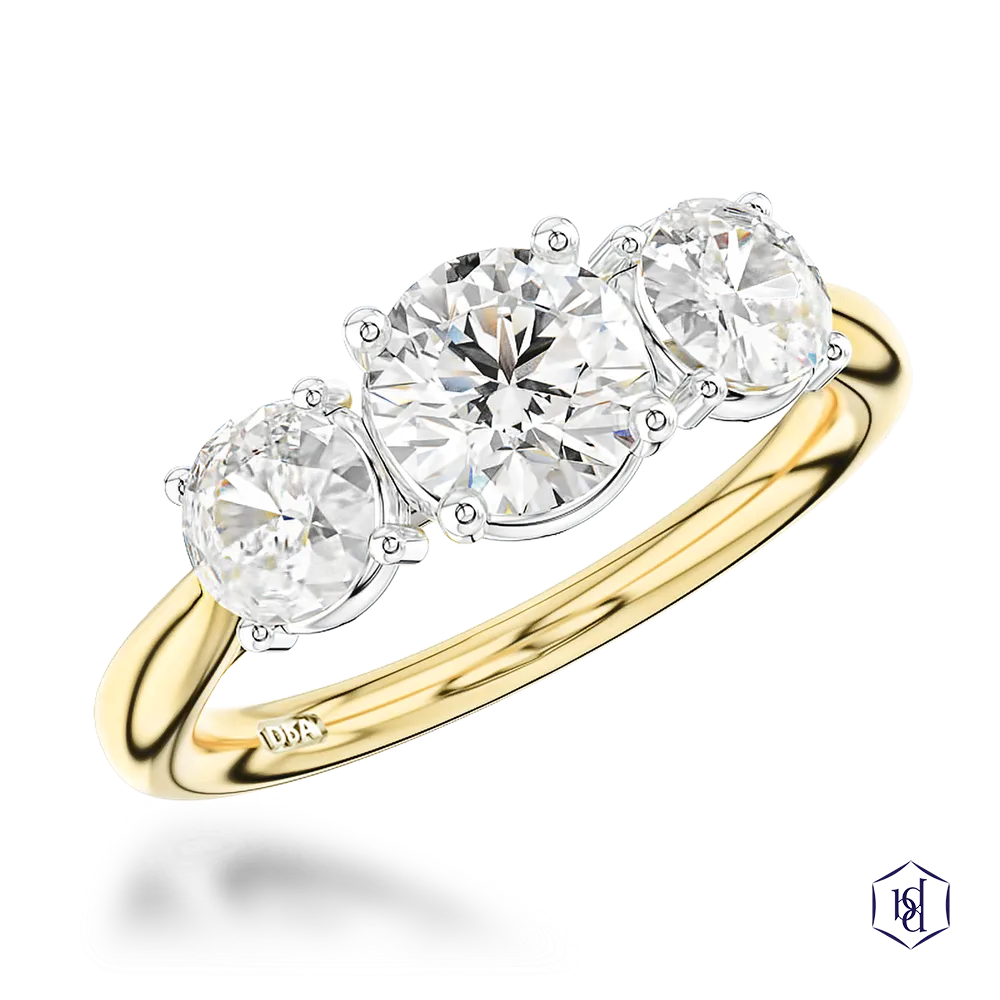 round brilliant cut diamond in a 18ct yellow gold shank and platinum head three stone plain band