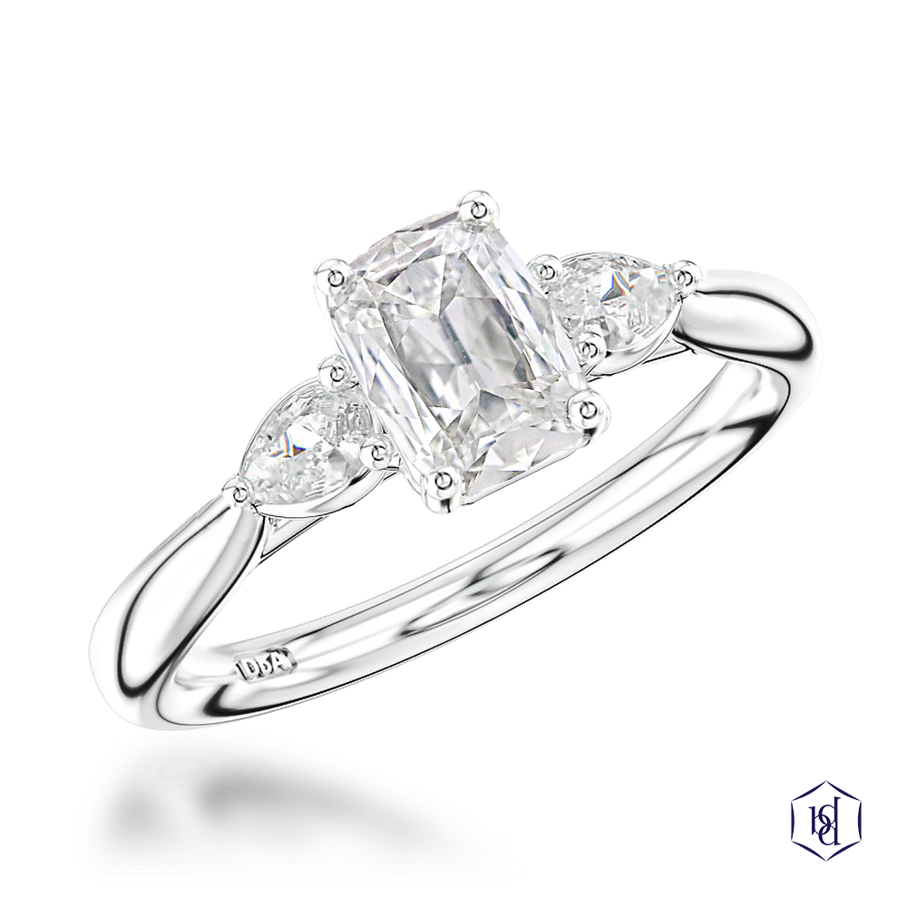 cushion cut diamond in a platinum three stone plain band