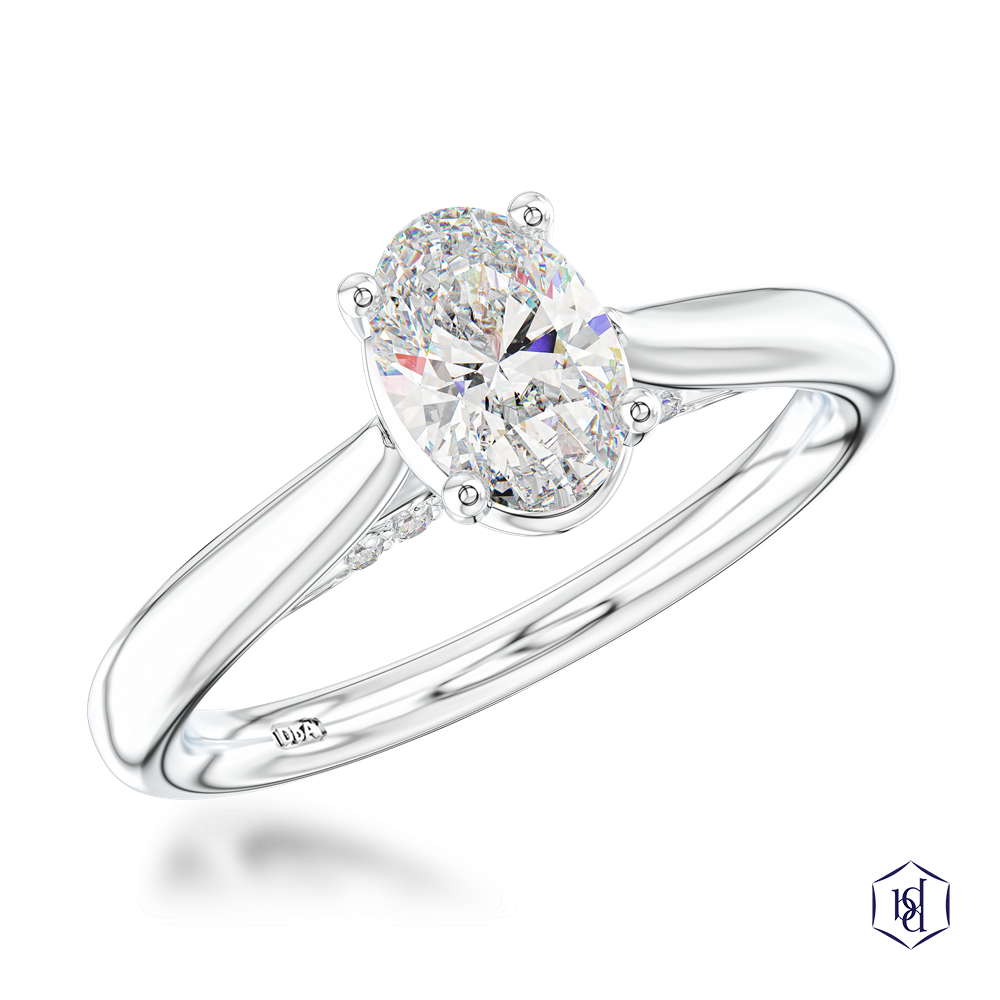 oval cut diamond in a platinum solitaire plain band