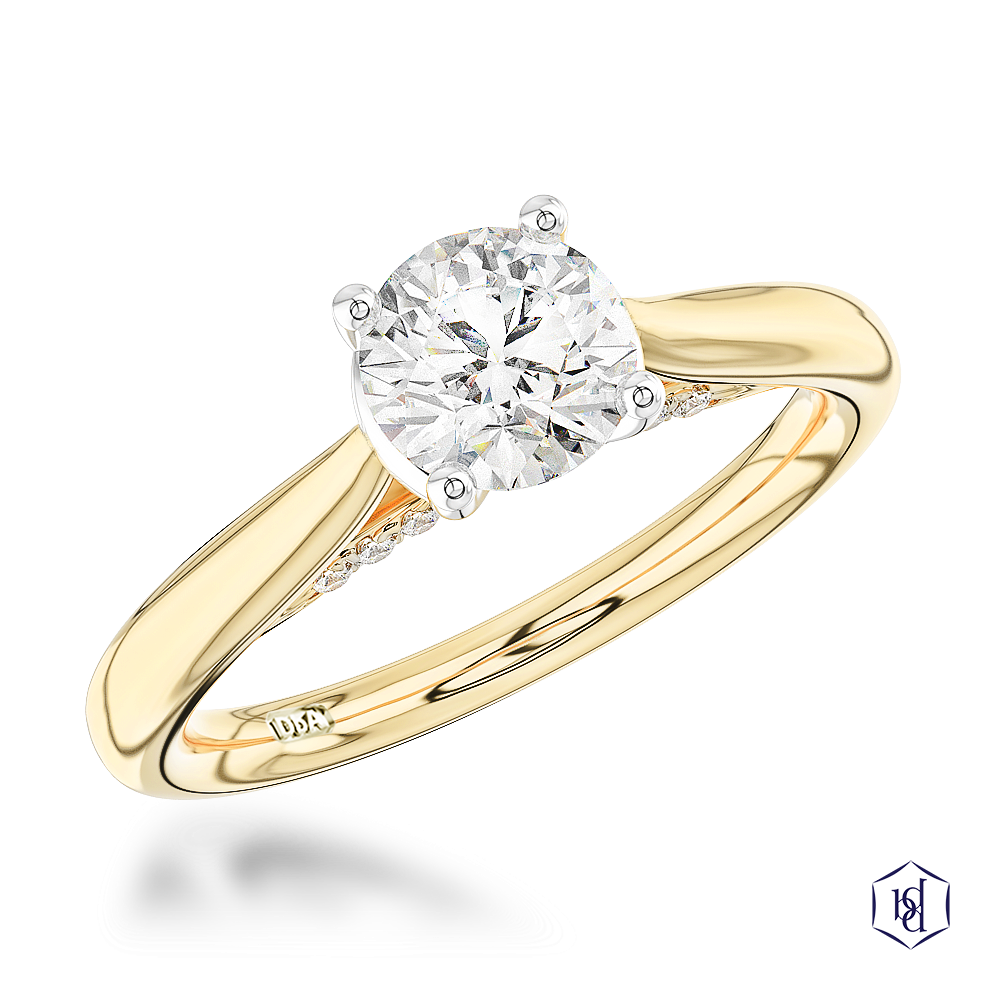 round brilliant cut diamond in a 18ct yellow gold shank and platinum head solitaire plain band