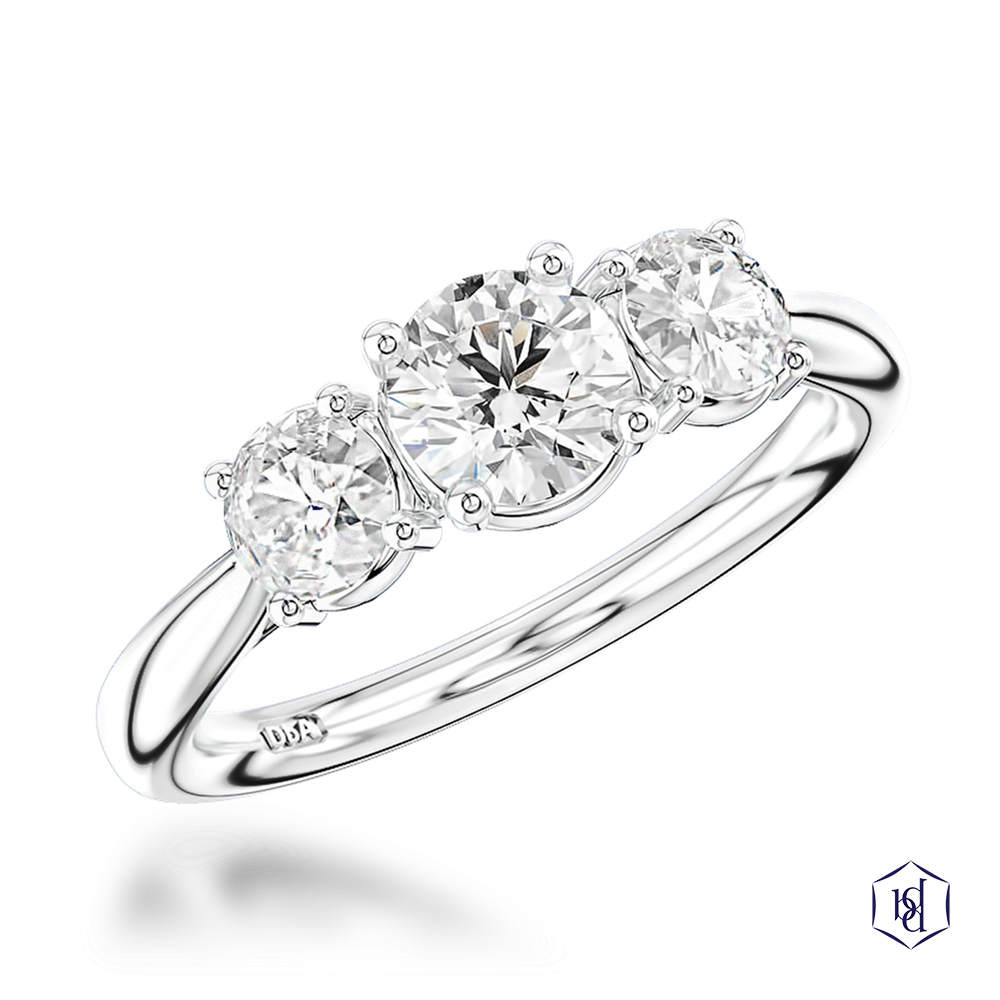round brilliant cut diamond in a platinum three stone plain band